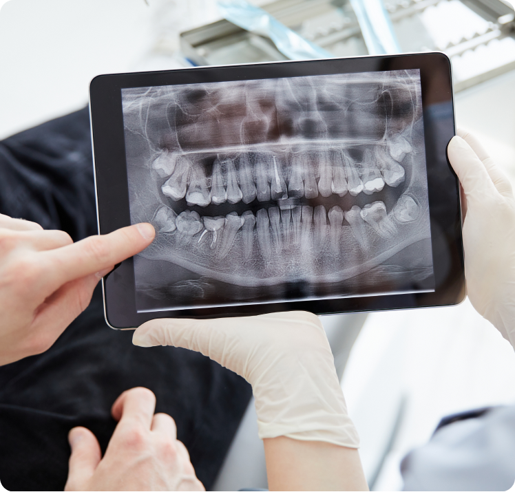 Dentist reviewing a custom treatment plan with a patient